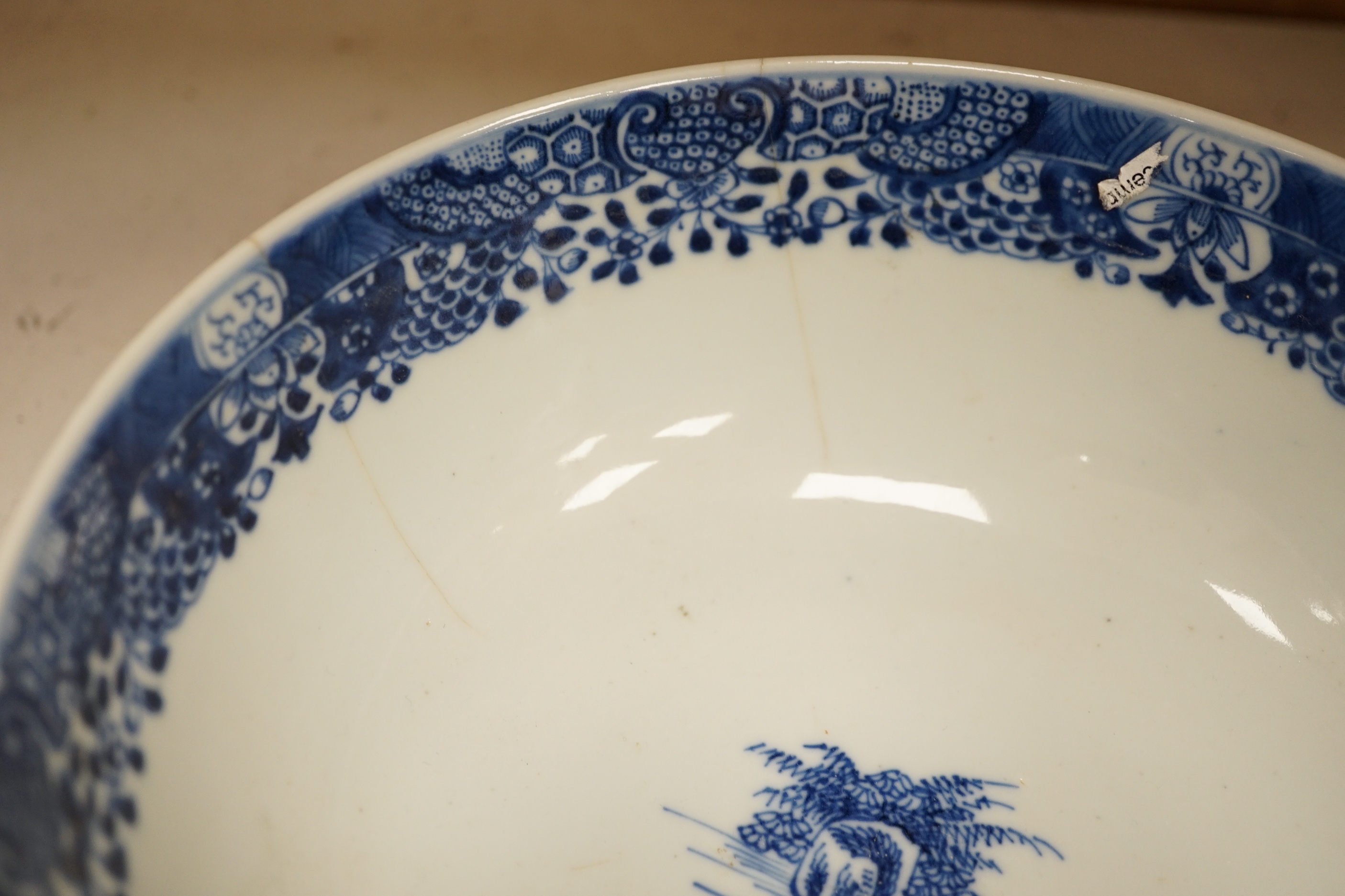 Assorted Chinese and Japanese ceramics comprising a famille rose bowl, two blue and white plates and a blue and white bowl, largest 30cm in diameter